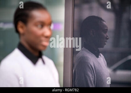 Berlin, Germany. 28th Jan, 2019. Diahala Doucouré works for a Berlin start-up, comes from Mali and spent most of her childhood and youth in a suburb of Paris. After graduating from high school, the 30-year-old decided to take off the headscarf she had been wearing since the beginning of puberty. On the eve of World Hijab Day on 1 February, a global dispute has flared up over whether or not Islamic headgear restricts the freedom of girls and women. Credit: Bernd von Jutrczenka/dpa/Alamy Live News Stock Photo