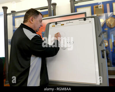 29 January 2019, US, San Francisco: Cartoonist Andreas Deja draws during an exhibition announcement at the Walt Disney Family Museum. With the exhibition 'Mickey Mouse: From Walt to the World', the Walt Disney Family Museum in San Francisco wants to pay tribute to the now 90-year-old iconic cartoon mouse. As curator of the show planned from May to January 2020, the long-time German Disney draughtsman Deja will collect more than 400 exhibits, including historical original sketches, film scenes, comics, and rare toys. Deja, 30 years chief draughtsman in Hollywood's Disney Studios, worked there o Stock Photo