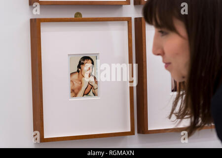 London, UK.  30 January 2019. A staff member views 'Arnold Schwarzenegger' (1977).  Preview of 'Andy Warhol Polaroid Pictures', an exhibition of over 60 portrait and self-portrait Polaroid photographs by Andy Warhol.  The works, which depict artists, actors, politicians and friends of his Factory entourage in New York during the 1970s and 80s, are on display 2 February to 13 April 2019 at Bastian Gallery in Mayfair.  Credit: Stephen Chung / Alamy Live News Stock Photo