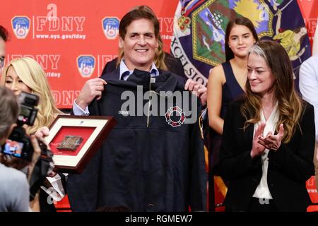 Brooklyn, NY, USA. 30th Jan, 2019. Mark Cuban pictured as Shark Tank investors and Cup Board Pro entrepreneurs, Kaley, Christian and Keira Young, present a donation for the FDNY Foundation, in honor of their father, Keith Young an FDNY firefighter who died last year of a 9/11-related illness. January 30, 2019 at FDNY Headquarters in Brooklyn, New York City. Credit: Diego Corredor/Media Punch/Alamy Live News Credit: MediaPunch Inc/Alamy Live News Stock Photo