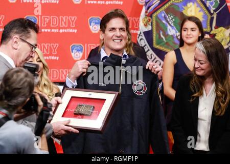 Brooklyn, NY, USA. 30th Jan, 2019. Mark Cuban pictured as Shark Tank investors and Cup Board Pro entrepreneurs, Kaley, Christian and Keira Young, present a donation for the FDNY Foundation, in honor of their father, Keith Young an FDNY firefighter who died last year of a 9/11-related illness. January 30, 2019 at FDNY Headquarters in Brooklyn, New York City. Credit: Diego Corredor/Media Punch/Alamy Live News Credit: MediaPunch Inc/Alamy Live News Stock Photo