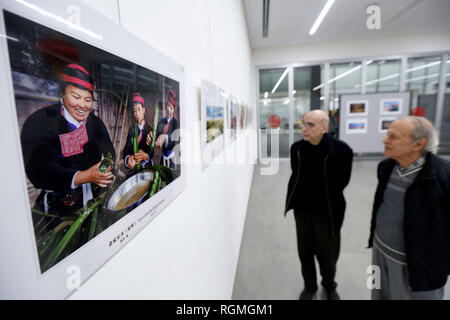 Beirut, Lebanon. 30th Jan, 2019. Visitors look at photos during a photo exhibition commemorating the 40th anniversary of China's reform and opening-up in Beirut, Lebanon, on Jan. 30, 2019. The photo exhibition on the 40th anniversary of China's reform and opening-up, jointly held by Chinese Embassy in Lebanon and the Lebanese Academy of Fine Arts, opened here on Wednesday and will last till Feb. 2. Credit: Bilal Jawich/Xinhua/Alamy Live News Stock Photo