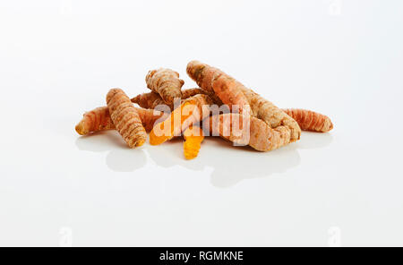 Curcuma roots on white ground Stock Photo