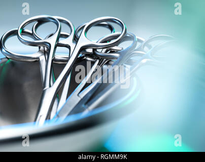 Surgical instruments, surgical scissors in a kidney shaped dish Stock Photo