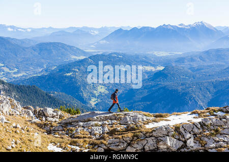 Germany, Upper Bavaria, Garmisch-Partenkirchen, Alpspitze, Osterfelderkopf, hiker walking Stock Photo