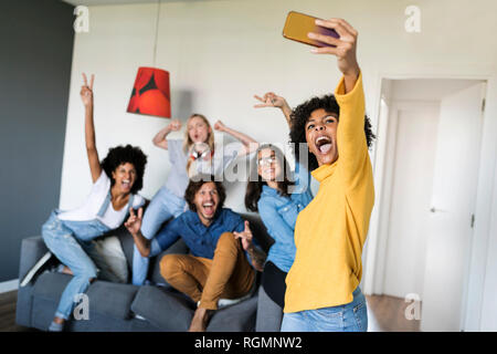 Cheerful friends taking a selfie at home Stock Photo