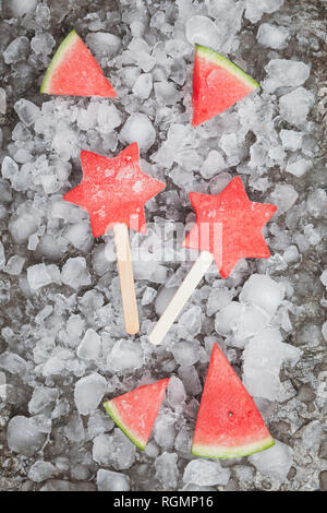 Homemade frozen watermelon star ice lollies Stock Photo