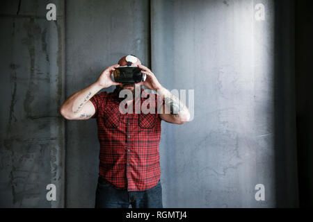 Bearded man wearing VR glasses Stock Photo