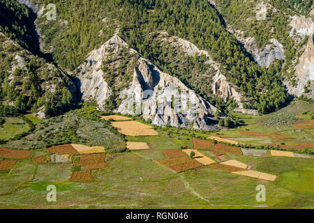 Panoramic aerial view on the agricultural countryside with buckwheat and barley fields of the Upper Marsyangdi valley Stock Photo