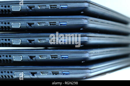 Computer connectivity. Sockets panel of Laptops Folded Stack Stock Photo