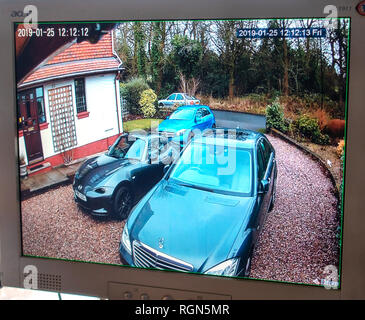 Monitor showing CCTV Camera surveillance from Multiple DVR Locations around a home and gardens at a private home in England Stock Photo