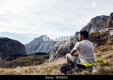 Austria, Tyrol, Rofan Mountains, hiker taking a break Stock Photo