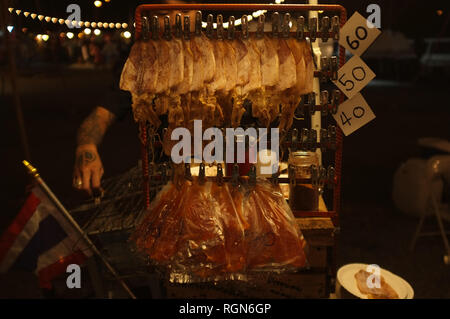 Street food Thailand , Crushed squid, Squids hang on the line . Stock Photo