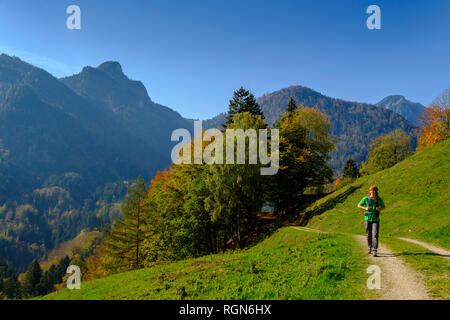 Germany, Bavaria, Upper Bavaria, Chiemgau, near Schleching, Achen Valley, hiker on hiking trail