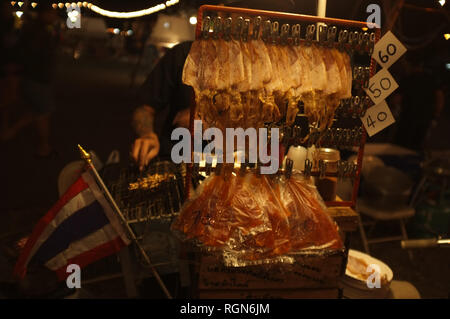 Street food Thailand , Crushed squid, Squids hang on the line . Stock Photo