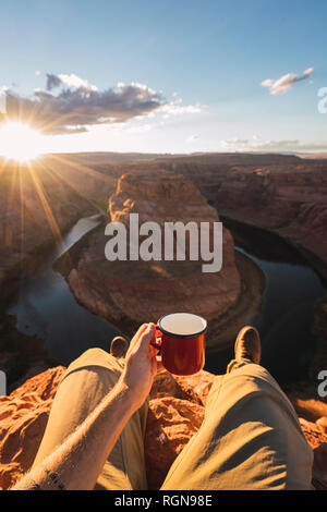 Young man holding red cup Stock Photo