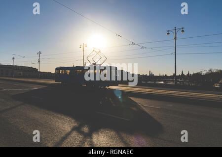 Russia, Moscow, Silhouette of a tram crossing a bridge over Moskva river Stock Photo