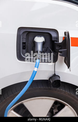 Electric car recharging Stock Photo