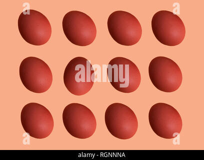 Pattern of colored chicken eggs isolated on pastel background. Top view. Minimalistic design Stock Photo