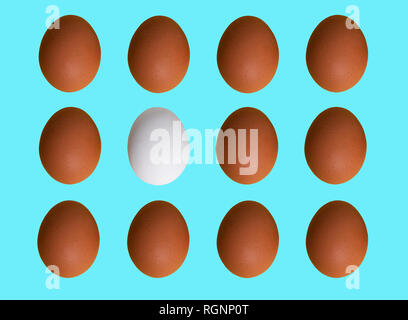 Pattern of colored chicken eggs isolated on pastel background. Top view. Minimalistic design Stock Photo