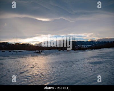 The river in the winter at sunset in Ukraine Stock Photo