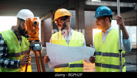 Team of architects people in group on construciton site Stock Photo