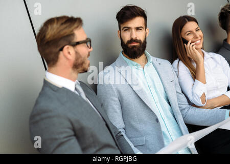 Group of perspective designers discussing in office Stock Photo