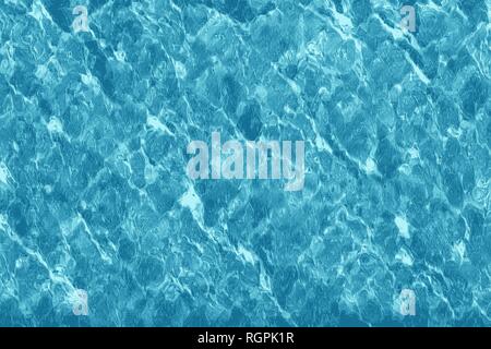 Texture of water in a swimming pool with light reflections Stock Photo