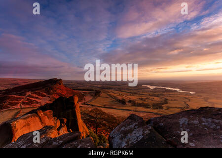 Hen Cloud and Tittesworth Reservoir from the Roaches at sunset. Peak District sandstone and the Staffordshire moorlands. Stock Photo