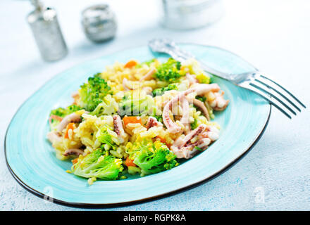 fried vegetables with seafood, fried broccoli with octopus Stock Photo