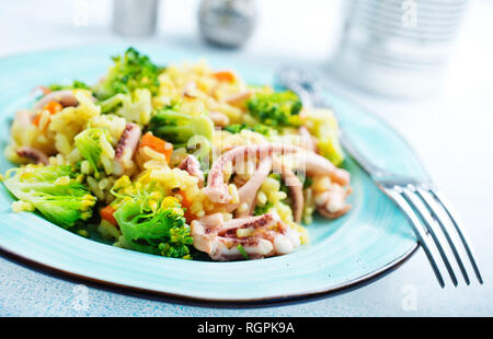 fried vegetables with seafood, fried broccoli with octopus Stock Photo