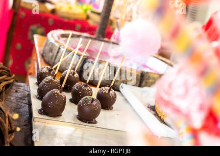 Roasted apples dipped in chocolate at a fair. Stock Photo