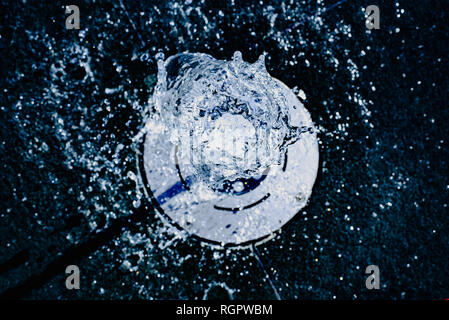 Water jet going up towards the camera, blue tones, background for hydrological concept. Stock Photo
