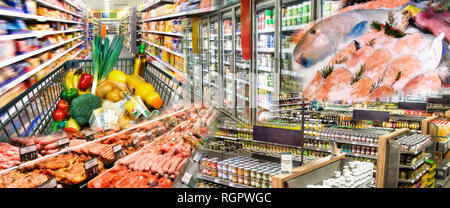 Wide range of goods with meat and fish, fruits and vegetables in the supermarket Stock Photo