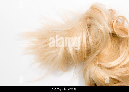 Blond natural hair extensions isolated on white background. Clipping patch, copy space Stock Photo