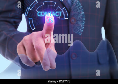 Close-up of man index finger touching contact us button on invisible display as futuristic concept Stock Photo