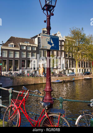 Camera surveillance sign on bridge over canal, Amsterdam, Netherlands, Europe Stock Photo