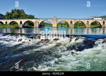 Side view of medieval stone bridge with archs Stock Photo
