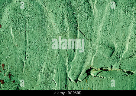closeup of a rustic green plastered wall to be used as a background Stock Photo