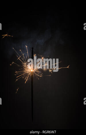Burning bengal fire stick New year sparkler candle isolated on black background. Realistic sparkler. Magic light stick. Christmas decoration Stock Photo