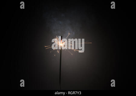 Burning bengal fire stick New year sparkler candle isolated on black background. Realistic sparkler. Magic light stick. Christmas decoration Stock Photo
