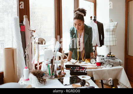 Concentrated Seamstress Putting Textile Table Measuring Tape Creation  Clothes Atelier Stock Photo by ©amixstudio 201120288