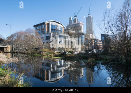 View of Woking town from the Basingstoke Canal, with the new high-rise development at Victoria Square, Surrey, UK Stock Photo