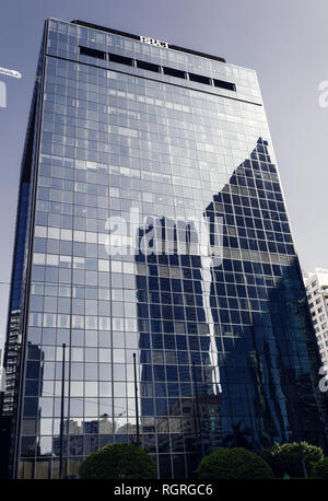 Miami, USA - October 30, 2015: skyscraper building with glass facade on blue sky. Architecture and design. Commercial property or real estate. Success and future concept. Stock Photo