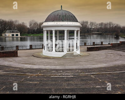 The historic bandstand stands by the boating lake at boating lake Stock Photo