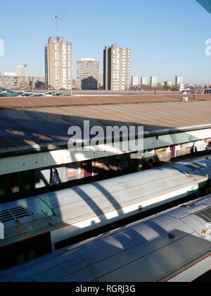 Looking over two platforms and across the skyline from Clapham Junction station in South London. Stock Photo