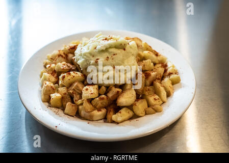 Yuca fried with hummus sauce. Stock Photo