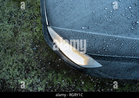 Frost covered car bonnet and headlight. Stock Photo