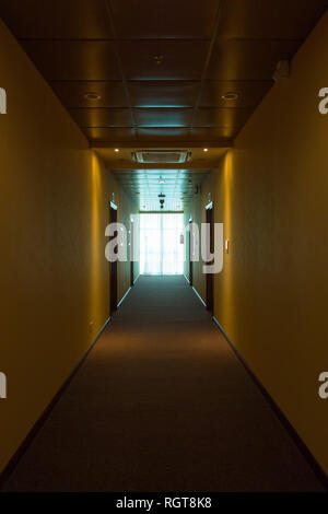 Empty hotel interior, light at the end corridor. The end concept Stock Photo