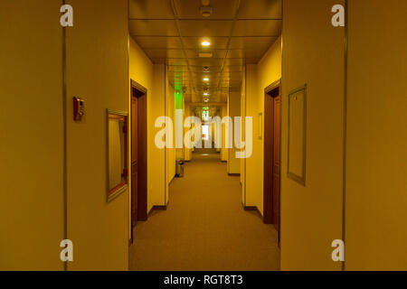 Empty hotel interior, light at the end corridor. The end concept Stock Photo